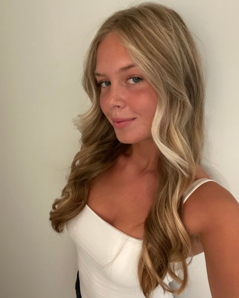 Long wavy blonde hair finished by Dina, front portrait